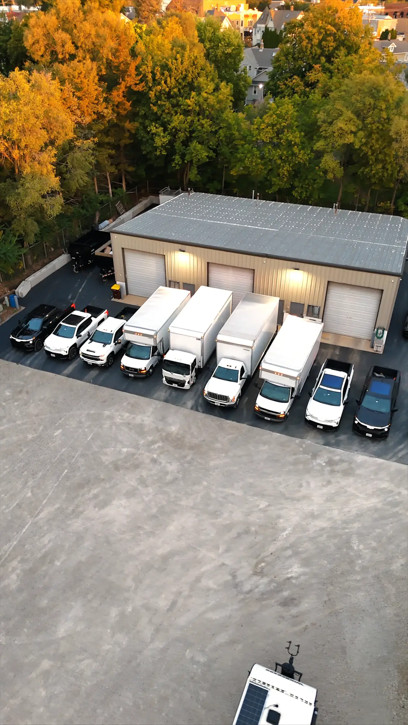 Building Energy Experts work trucks lined up at the shop